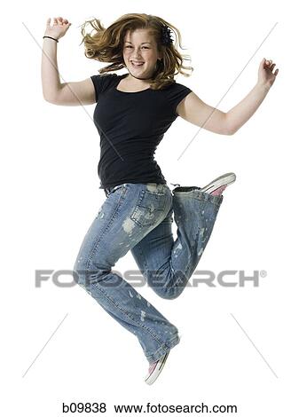 Portrait of a teenage girl jumping View Large Photo Image Stock Photo - Portrait of a teenage girl jumping. Fotosearch