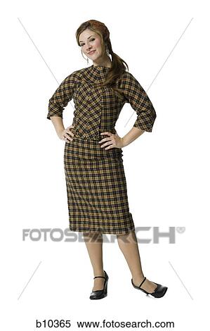 Stock Photography - Portrait of a teenage girl posing with her hands on her hips. Fotosearch