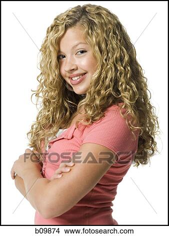 Portrait of a teenage girl with her arms crossed View Large Photo Image Picture - Portrait of a teenage girl with her arms crossed. Fotosearch