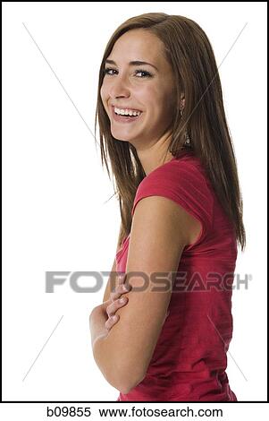 Portrait of a teenage girl with her arms crossed View Large Photo Image Stock Photography - Portrait of a teenage girl with her arms crossed. Fotosearch