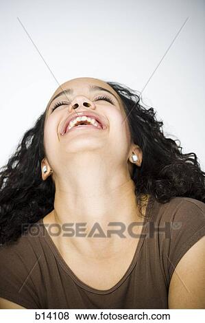 Portrait of a woman laughing and leaning back View Large Photo Image Stock Photo - Portrait of a woman laughing and leaning back. Fotosearch