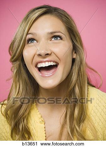 Portrait of a woman smiling looking up View Large Photo Image Stock Image - Portrait of a woman smiling looking up. Fotosearch