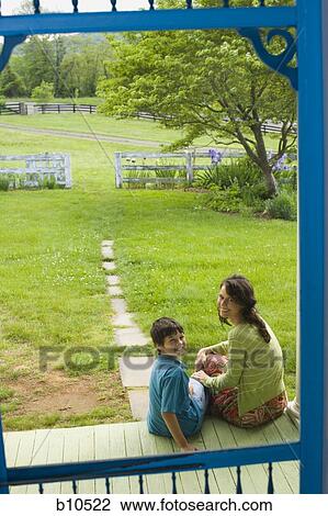 Stock Image - Portrait of a woman smiling with her son and smiling. Fotosearch
