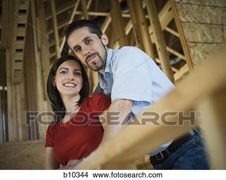 Portrait of a young couple smiling View Large Photo Image Picture - Portrait of a young couple smiling. Fotosearch