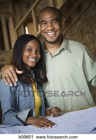 Portrait of a young couple smiling View Large Photo Image Stock Image - Portrait of a young couple smiling. Fotosearch