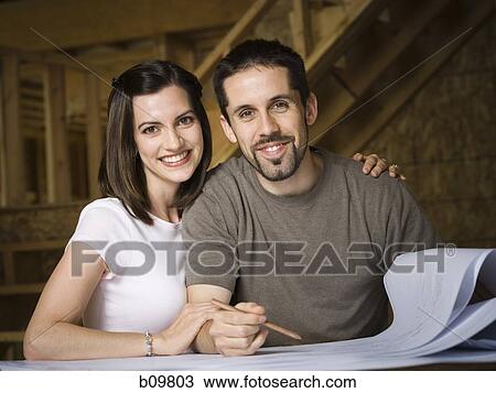Portrait of a young couple smiling View Large Photo Image Stock Image - Portrait of a young couple smiling. Fotosearch