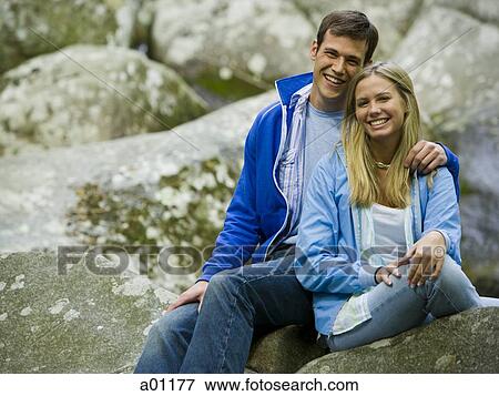 Stock Photo - Portrait of a young couple smiling. Fotosearch