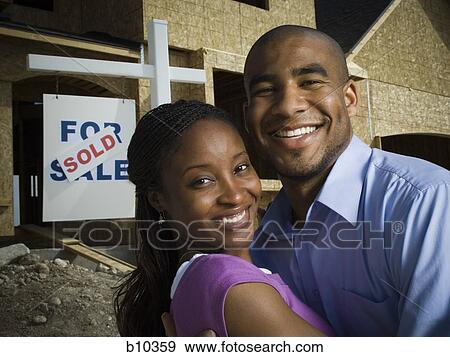 Portrait of a young couple smiling View Large Photo Image Stock Photo - Portrait of a young couple smiling. Fotosearch