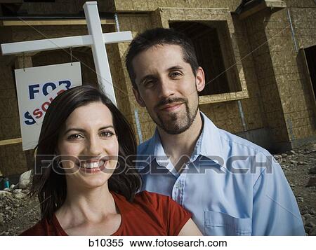 Portrait of a young couple smiling View Large Photo Image Stock Photography - Portrait of a young couple smiling. Fotosearch