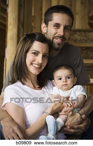 Portrait of a young couple with their son View Large Photo Image Stock Photo - Portrait of a young couple with their son. Fotosearch
