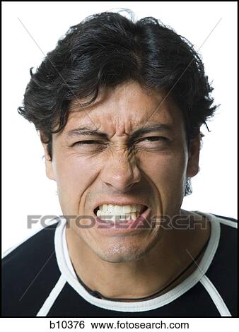 Portrait of a young man clenching his teeth View Large Photo Image Stock Photograph - Portrait of a young man clenching his teeth. Fotosearch