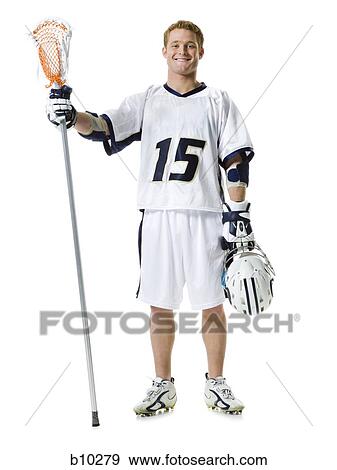 Portrait of a young man holding a lacrosse stick and a helmet View Large Photo Image Stock Photo - Portrait of a young man holding a lacrosse stick and a helmet. Fotosearch