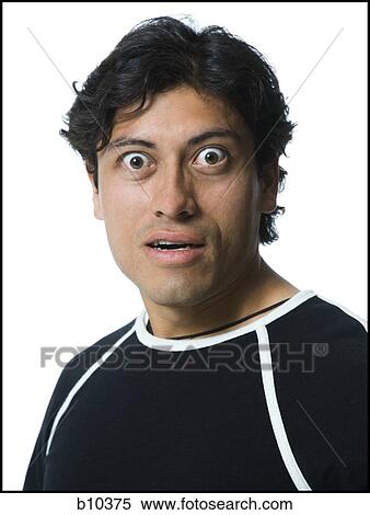 Portrait of a young man looking surprised View Large Photo Image Stock Photography - Portrait of a young man looking surprised. Fotosearch