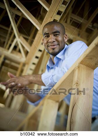 Stock Image - Portrait of a young man smiling. Fotosearch
