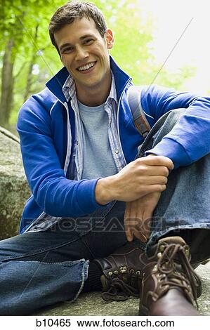 Portrait of a young man smiling View Large Photo Image Stock Photography - Portrait of a young man smiling. Fotosearch