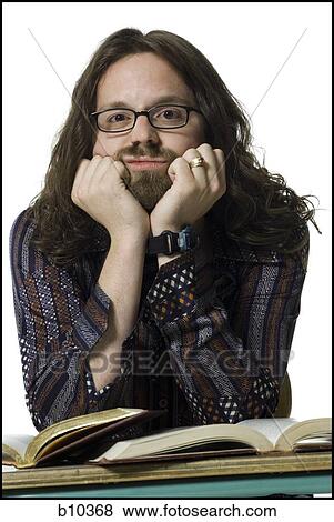 Portrait of a young man thinking with his hand on his chin View Large Photo Image Stock Photo - Portrait of a young man thinking with his hand on his chin. Fotosearch