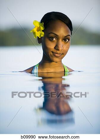 Portrait of a young woman in a swimming pool View Large Photo Image Stock Image - Portrait of a young woman in a swimming pool. Fotosearch