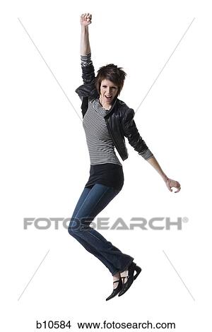 Portrait of a young woman jumping View Large Photo Image Picture - Portrait of a young woman jumping. Fotosearch