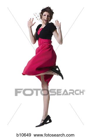Portrait of a young woman jumping View Large Photo Image Stock Photo - Portrait of a young woman jumping. Fotosearch