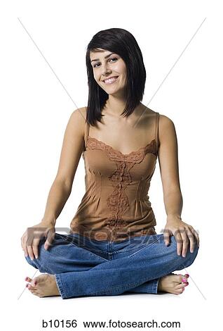 Portrait of a young woman sitting on the floor View Large Photo Image Stock Photograph - Portrait of a young woman sitting on the floor. Fotosearch