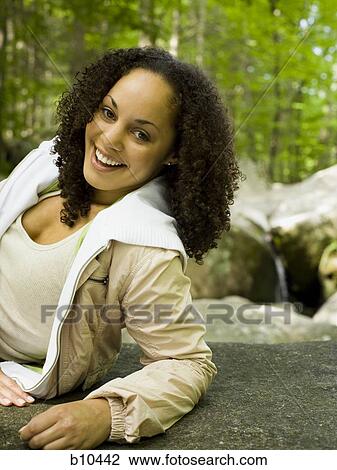 Portrait of a young woman smiling View Large Photo Image Stock Image - Portrait of a young woman smiling. Fotosearch