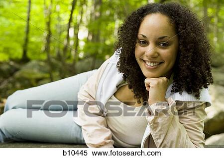 Stock Photography - Portrait of a young woman smiling. Fotosearch