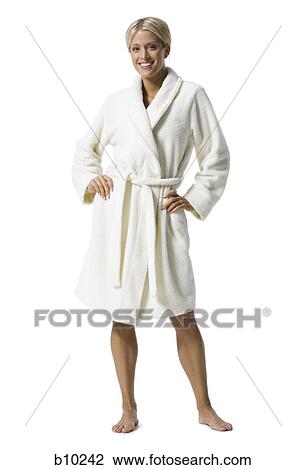 Portrait of a young woman standing in bathrobe View Large Photo Image Stock Image - Portrait of a young woman standing in bathrobe. Fotosearch
