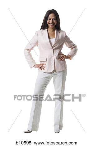 Portrait of a young woman standing with her hands on her hips View Large Photo Image Stock Photography - Portrait of a young woman standing with her hands on her hips. Fotosearch