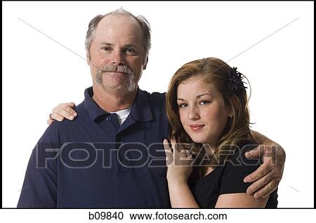 Portrait of an elderly man standing with his daughter View Large Photo Image Stock Image - Portrait of an elderly man standing with his daughter. Fotosearch