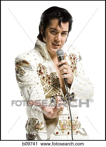 Portrait of an Elvis impersonator singing into a microphone View Large Photo Image Stock Image - Portrait of an Elvis impersonator singing into a microphone. Fotosearch