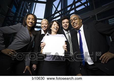 Portrait of five business executives standing with a blank sign View Large Photo Image Stock Image - Portrait of five business executives standing with a blank sign. Fotosearch