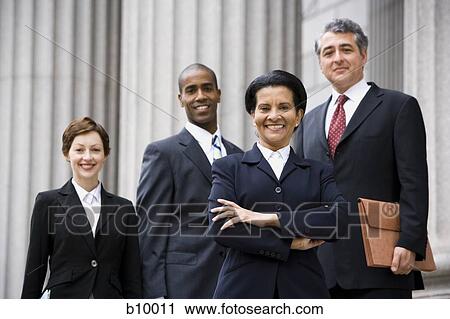 Portrait of lawyers smiling in front of a courthouse View Large Photo Image Stock Image - Portrait of lawyers smiling in front of a courthouse. Fotosearch