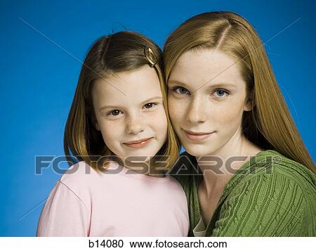 Stock Image - Portrait of teenage girl and young girl. Fotosearch