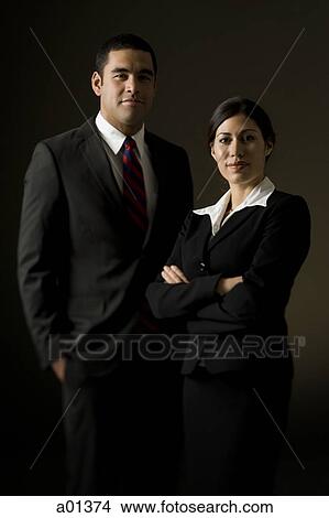 Portrait of young businessman and businesswoman View Large Photo Image Picture - Portrait of young businessman and businesswoman. Fotosearch