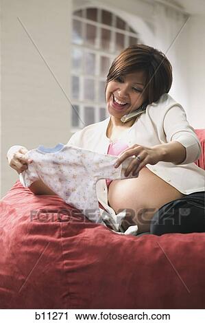Pregnant woman talking on phone View Large Photo Image Stock Image - Pregnant woman talking on phone. Fotosearch