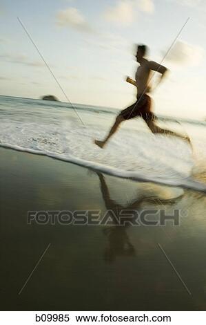 Profile of a man running on the beach View Large Photo Image Stock Photography - Profile of a man running on the beach. Fotosearch