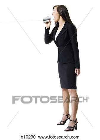 Profile of a teenage girl holding a tin can phone and shouting View Large Photo Image Stock Image - Profile of a teenage girl holding a tin can phone and shouting. Fotosearch