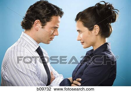 Profile of a young man and a woman looking at each other View Large Photo Image Stock Image - Profile of a young man and a woman looking at each other. Fotosearch