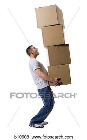 Profile of a young man holding a stack of cardboard boxes View Large Photo Image Stock Photo - Profile of a young man holding a stack of cardboard boxes. Fotosearch