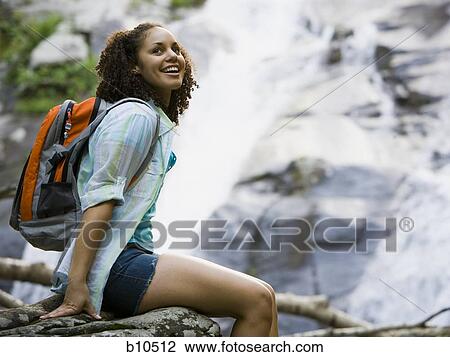 Profile of a young woman looking away View Large Photo Image Stock Image - Profile of a young woman looking away. Fotosearch