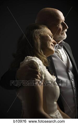 Stock Photograph - Profile of older couple. Fotosearch