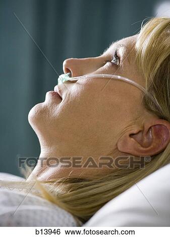 Profile of woman in hospital with respirator View Large Photo Image Stock Photograph - Profile of woman in hospital with respirator. Fotosearch