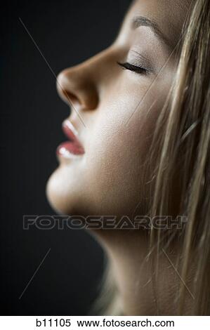 Profile of young woman with eyes closed View Large Photo Image Stock Photography - Profile of young woman with eyes closed. Fotosearch