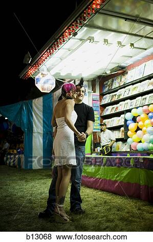 Stock Photo - Punk couple at a fairground. Fotosearch