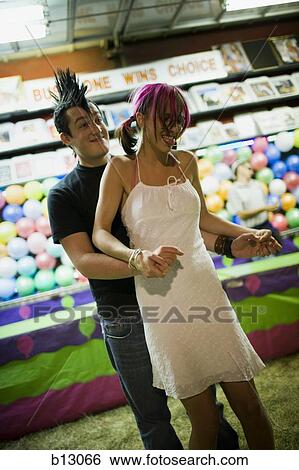 Punk couple at a fairground View Large Photo Image Stock Photograph - Punk couple at a fairground. Fotosearch