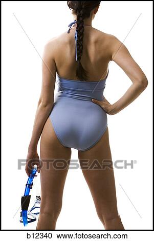 Rear view of woman in bathing suit holding snorkel View Large Photo Image Stock Image - Rear view of woman in bathing suit holding snorkel. Fotosearch