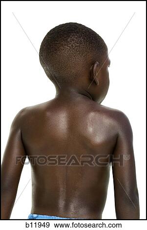 Stock Photo - Rear view of young boy's back. Fotosearch