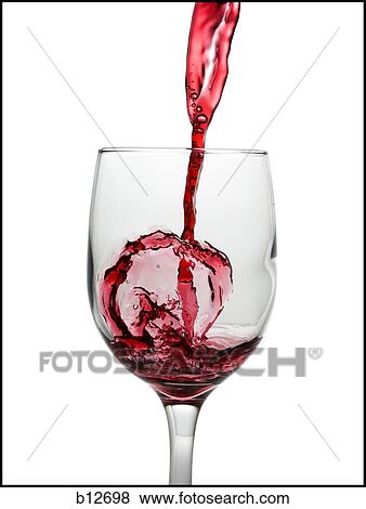 Stock Photo - Red wine pouring into wine glass. Fotosearch