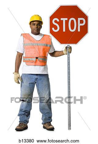 Road worker with stop sign and hardhat View Large Photo Image Stock Image - Road worker with stop sign and hardhat. Fotosearch