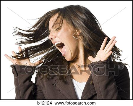 Picture - Screaming and excited young woman. Fotosearch